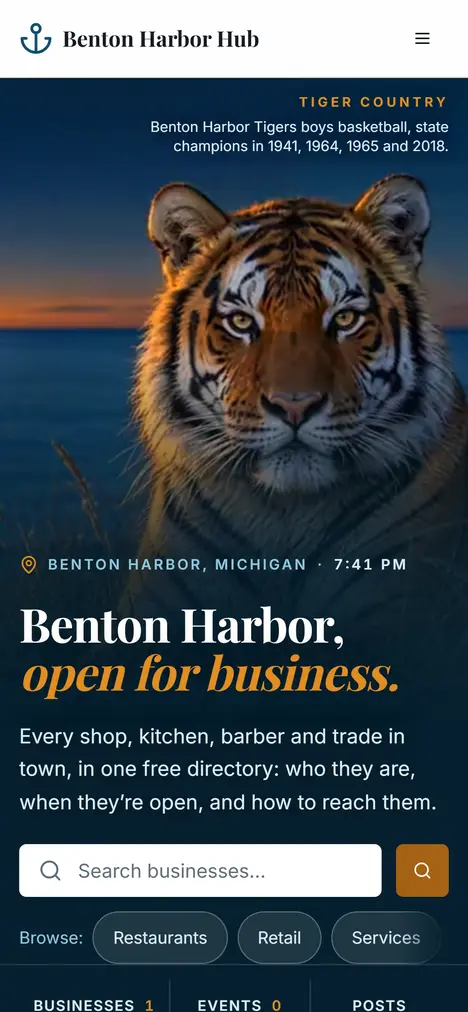 Benton Harbor Hub on a phone: a generated tiger in dune grass at dusk, above the headline "Benton Harbor, open for business."